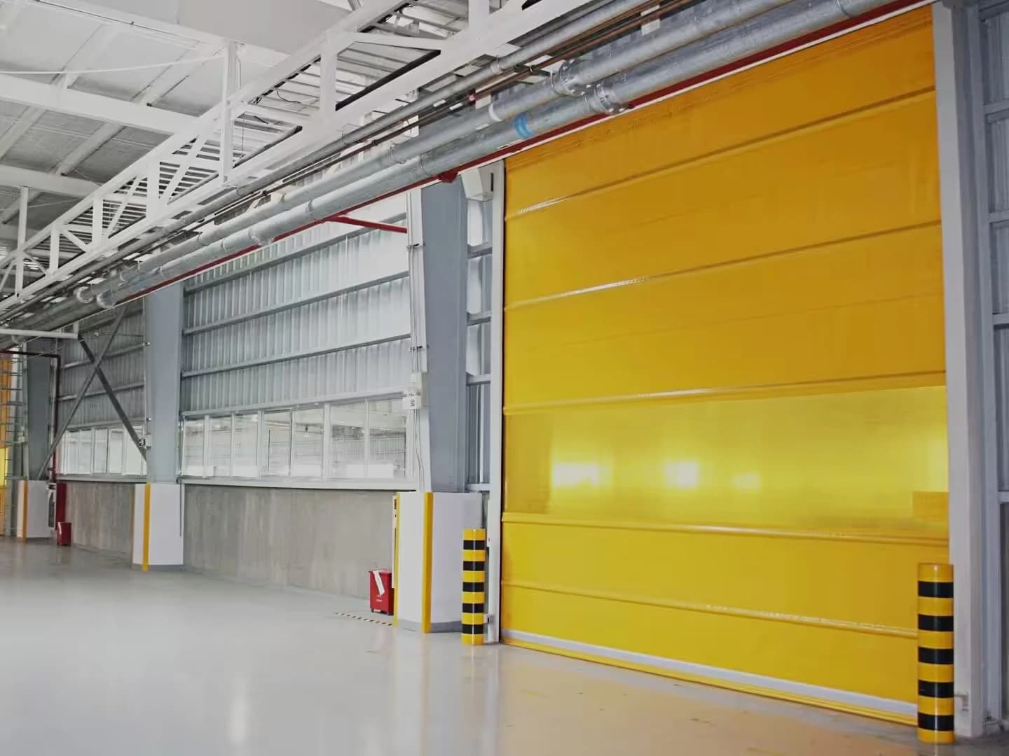 Yellow roll-up curtain at a warehouse opening