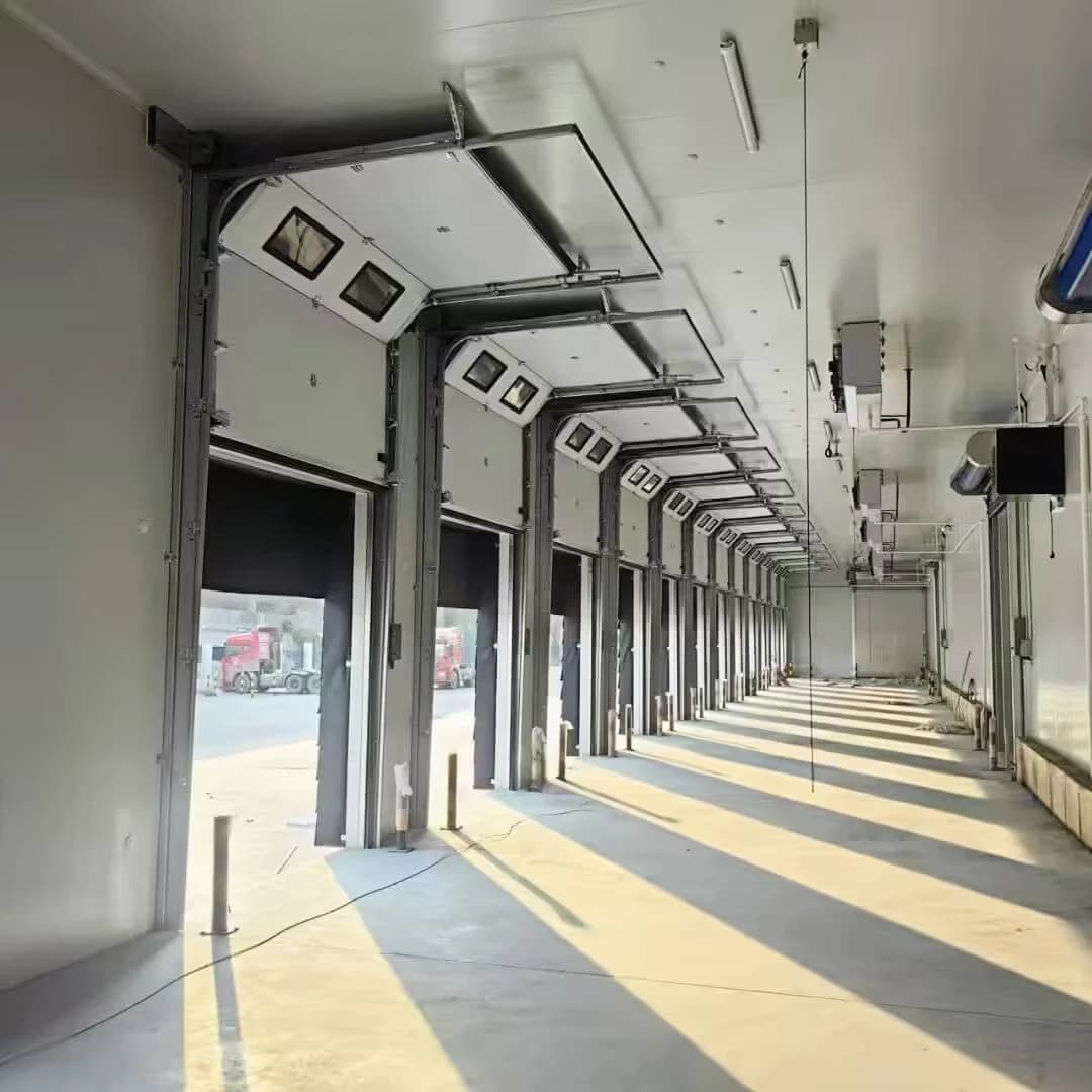Overhead tracks along a row of sectional doors